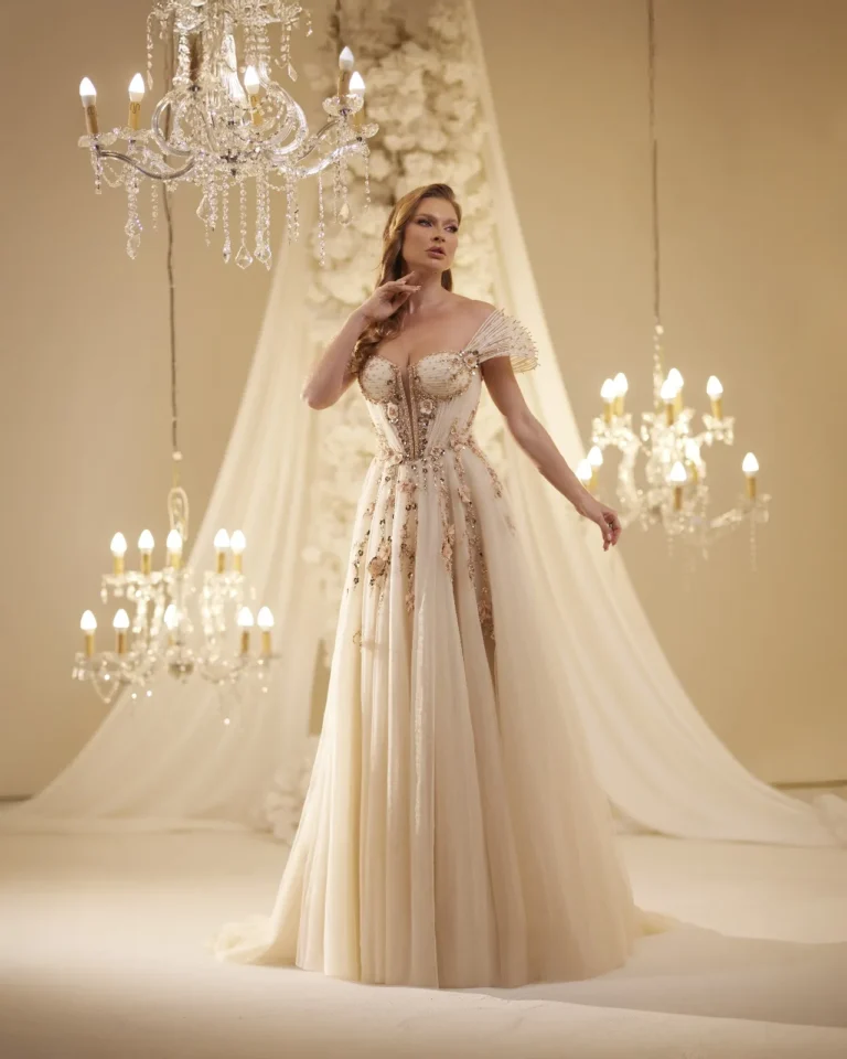 Model wearing a champagne evening gown front.
