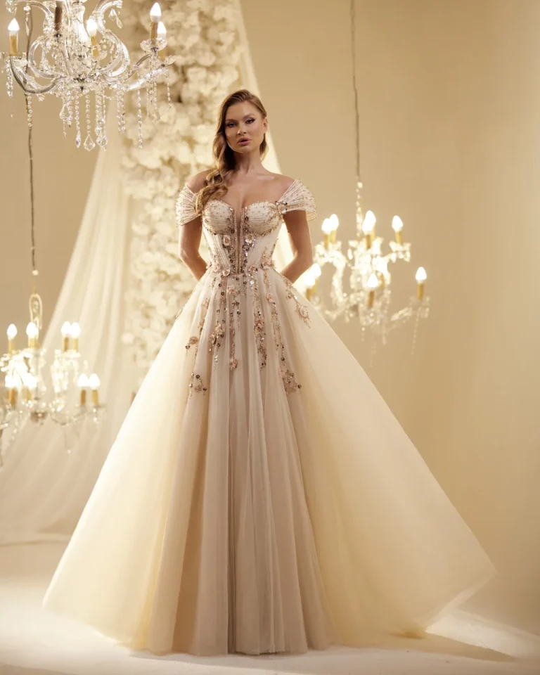 Model wearing a champagne full skirt gown.