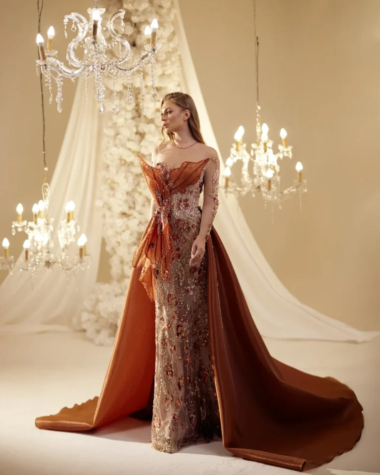 Model wearing a copper evening gown side view.