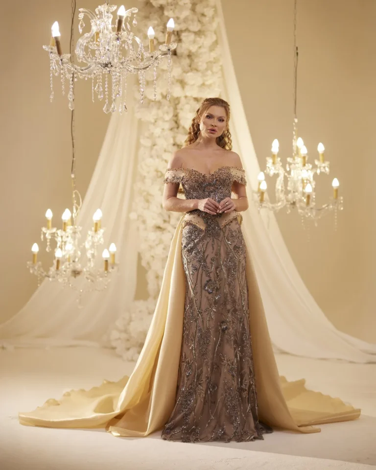 Model wearing a gold evening gown front.