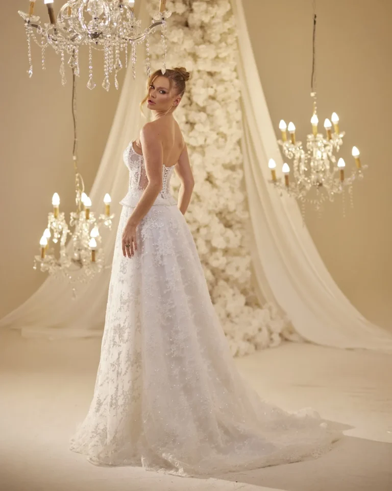Model wearing a ivory bridal gown back.