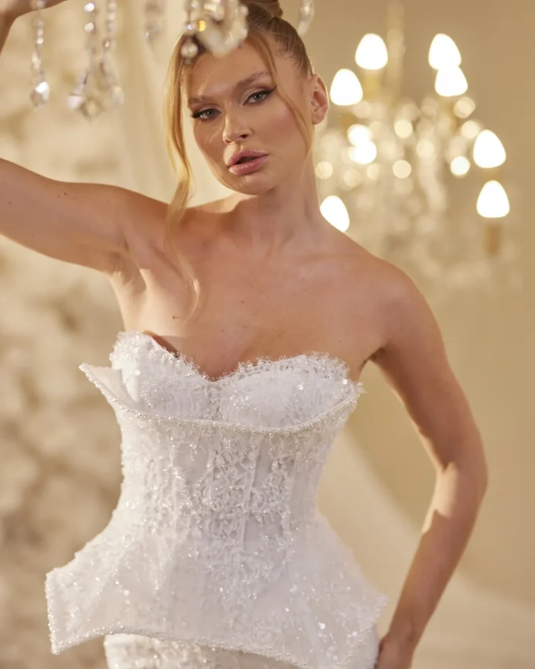 Model wearing a ivory bridal gown bodice detail.