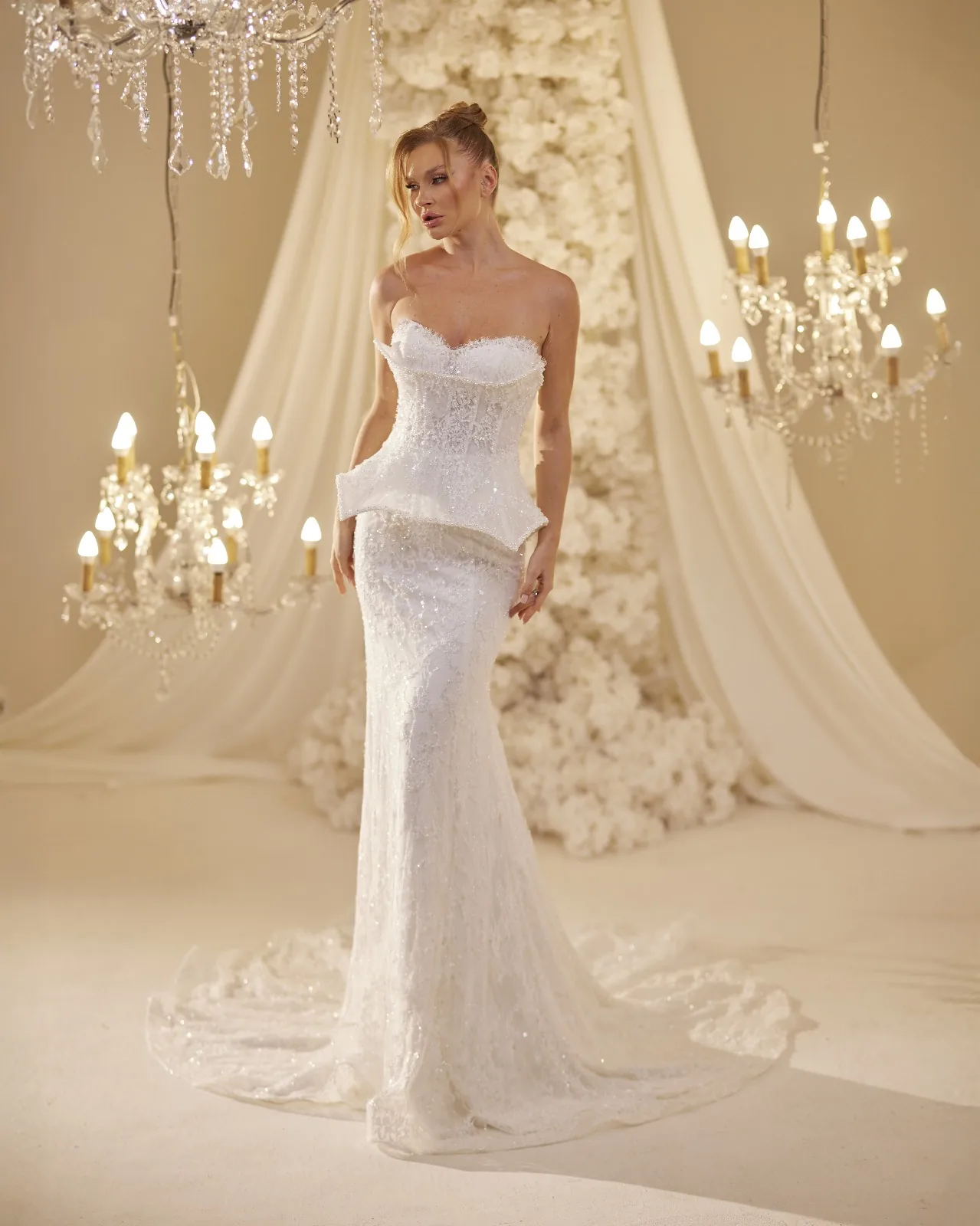 Ivory bridal gown with a fitted bodice and flowing skirt
