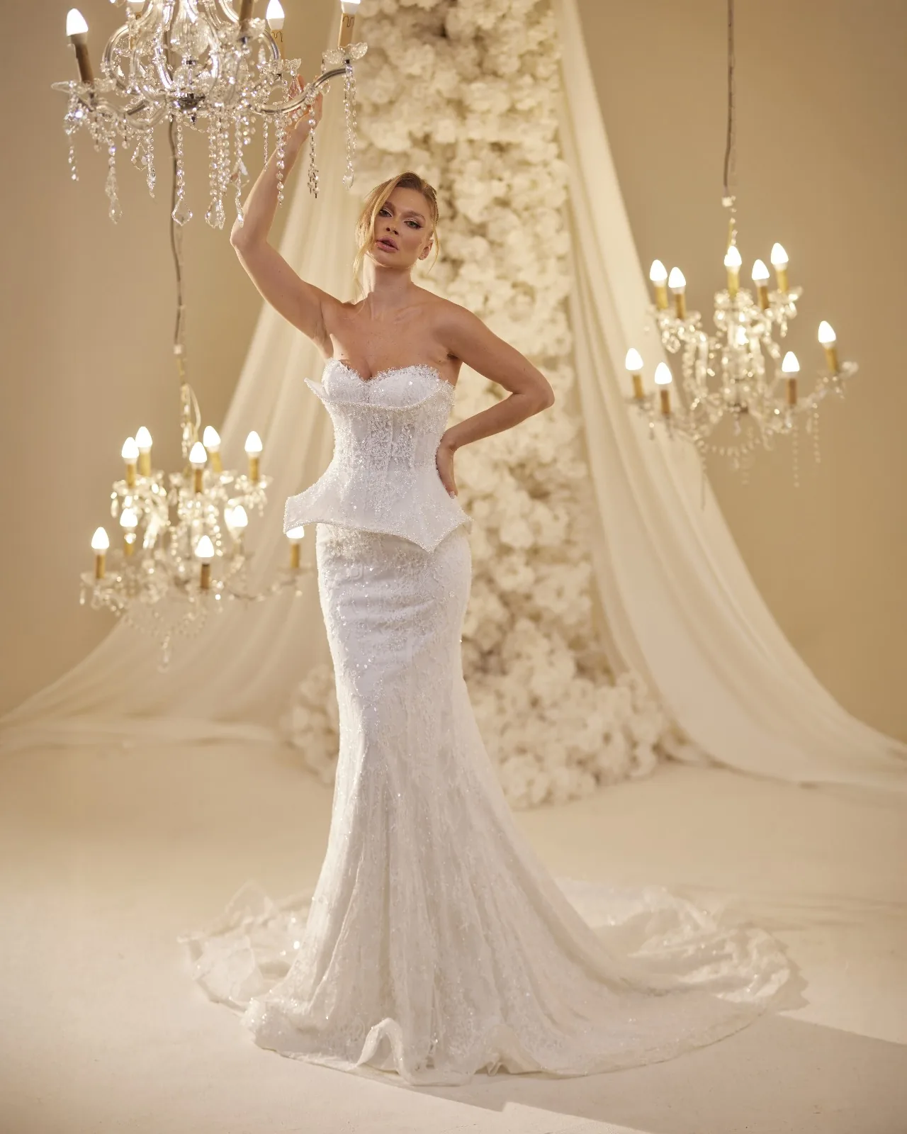 Side view of an ivory bridal gown with a flowing skirt
