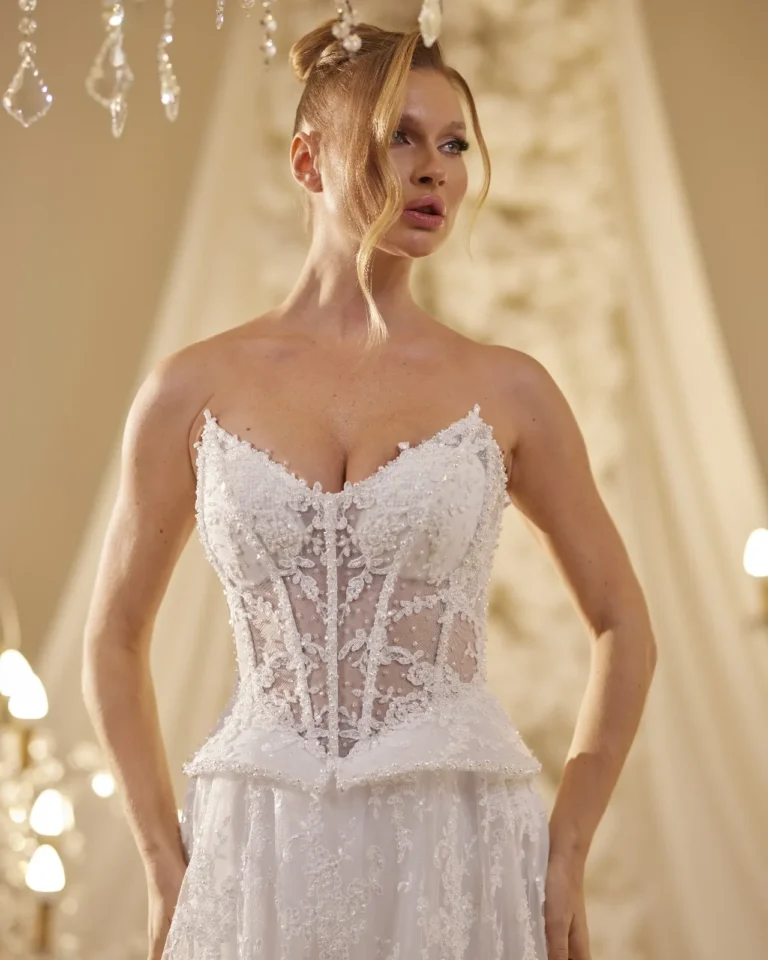 Model wearing a ivory bridal gown structured bodice.