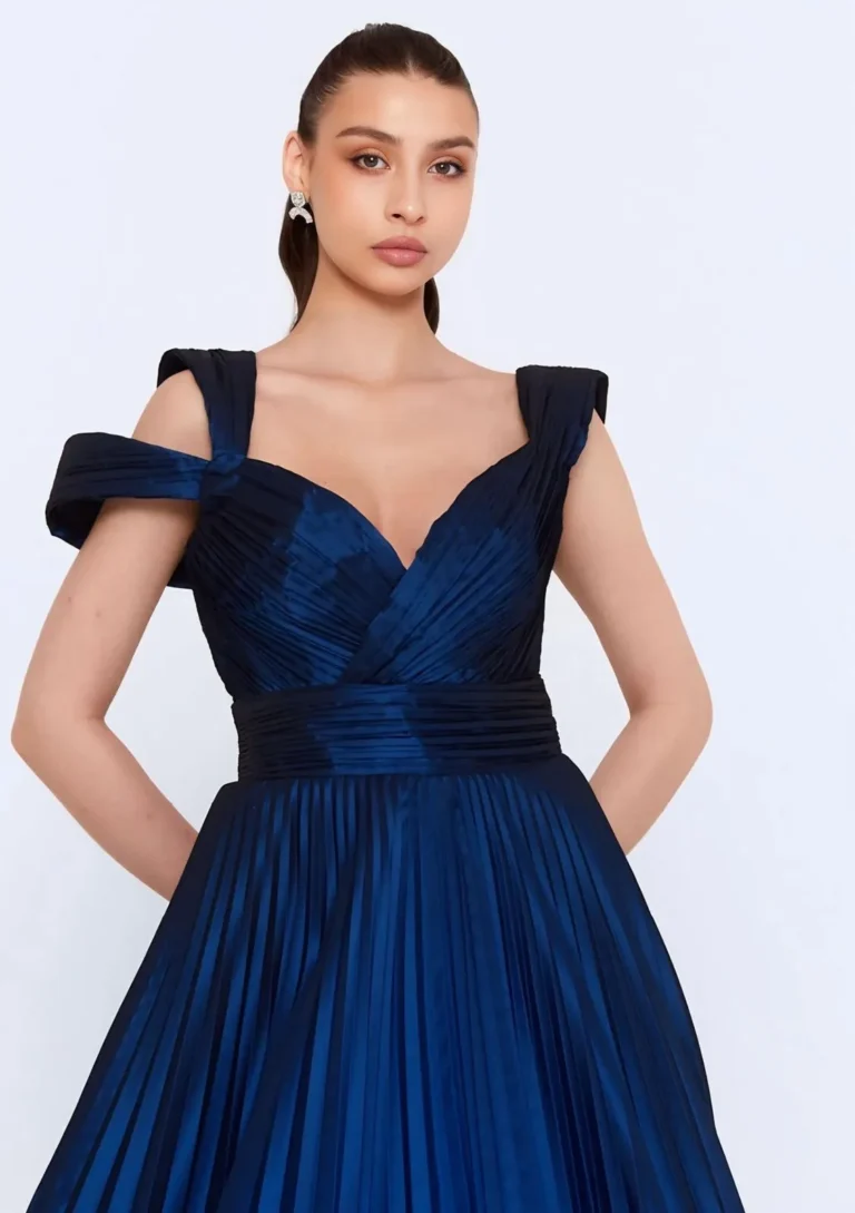 Model wearing a navy blue gown bodice detail.