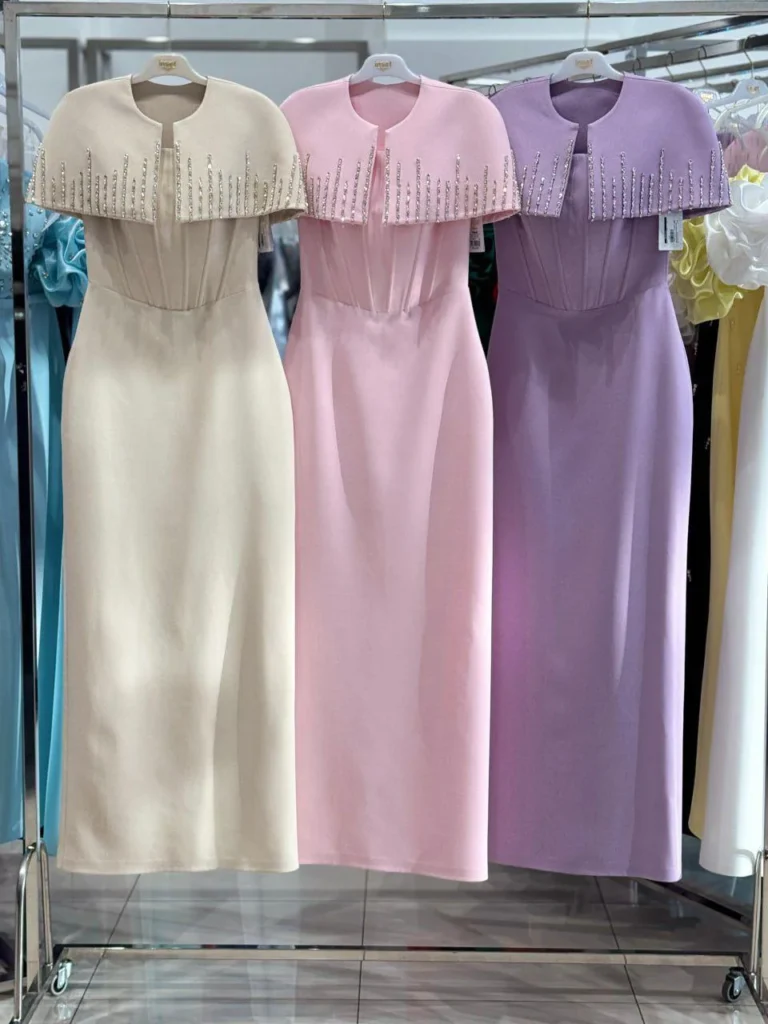Pastel pink and lilac dresses display.