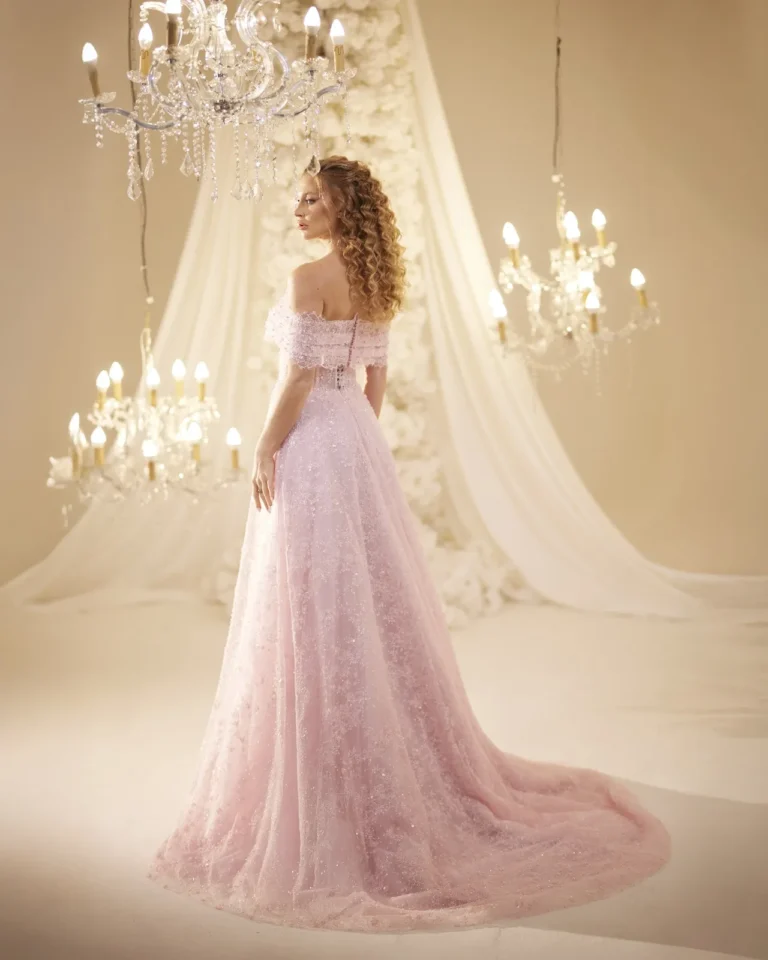 Model wearing a pink evening gown back.