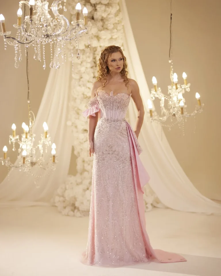 Model wearing a pink evening gown front.