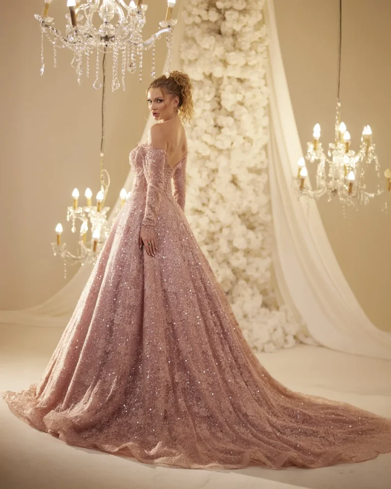 Model wearing a rose evening gown back train.