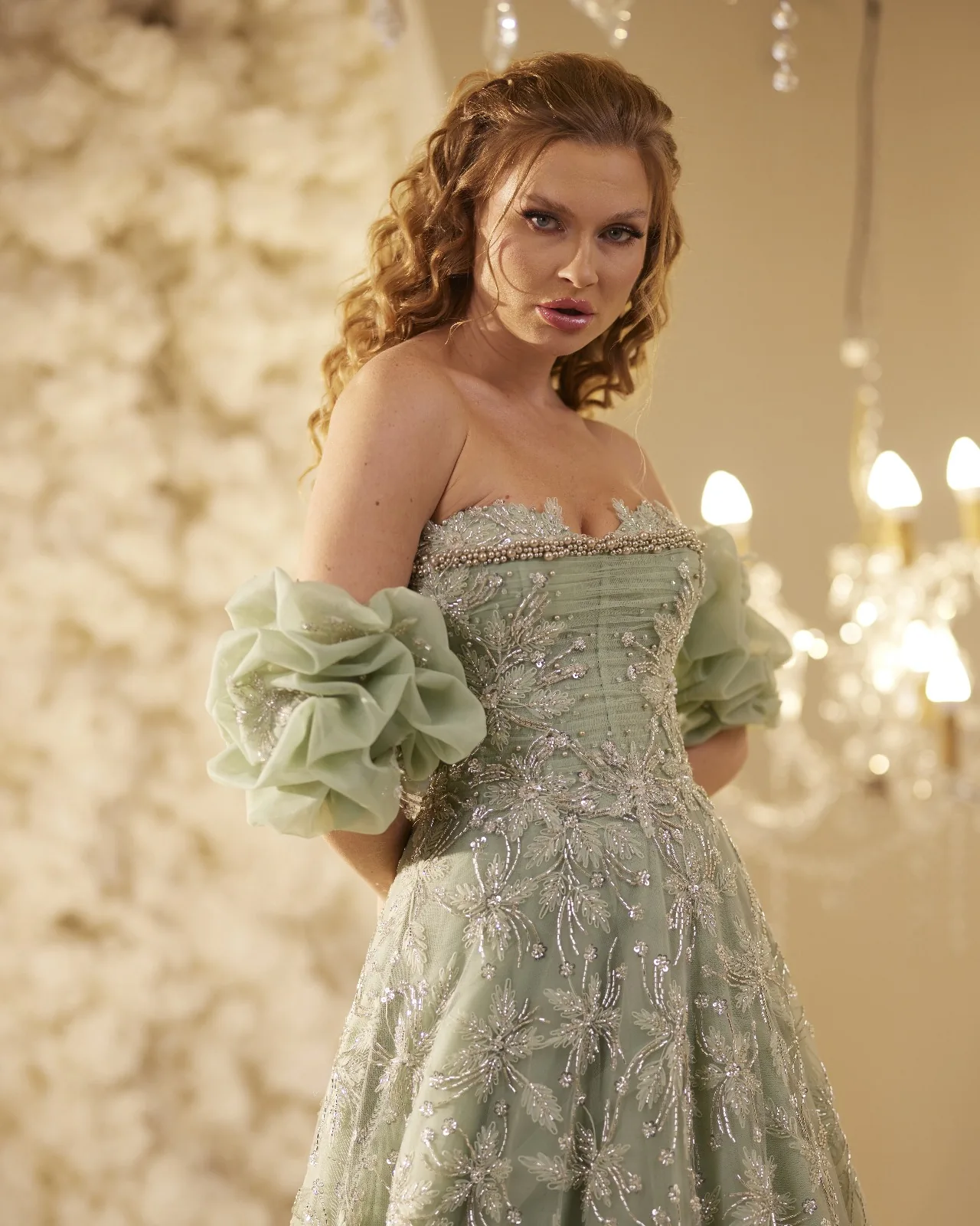 Sage green gown with floral details at the neckline